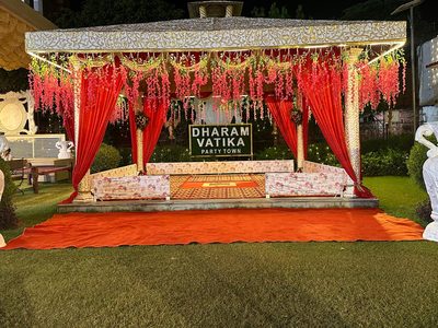 Floral mandap gazebo with red drapes at Dharam Vatika Party Town, Sohna Gurgaon