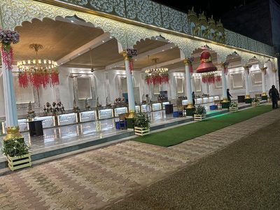 Illuminated covered arcade with chandeliers at night, Dharam Vatika Sohna Gurgaon
