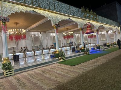 Covered dining arcade beside lawn walkway at Dharam Vatika, Sohna Gurgaon